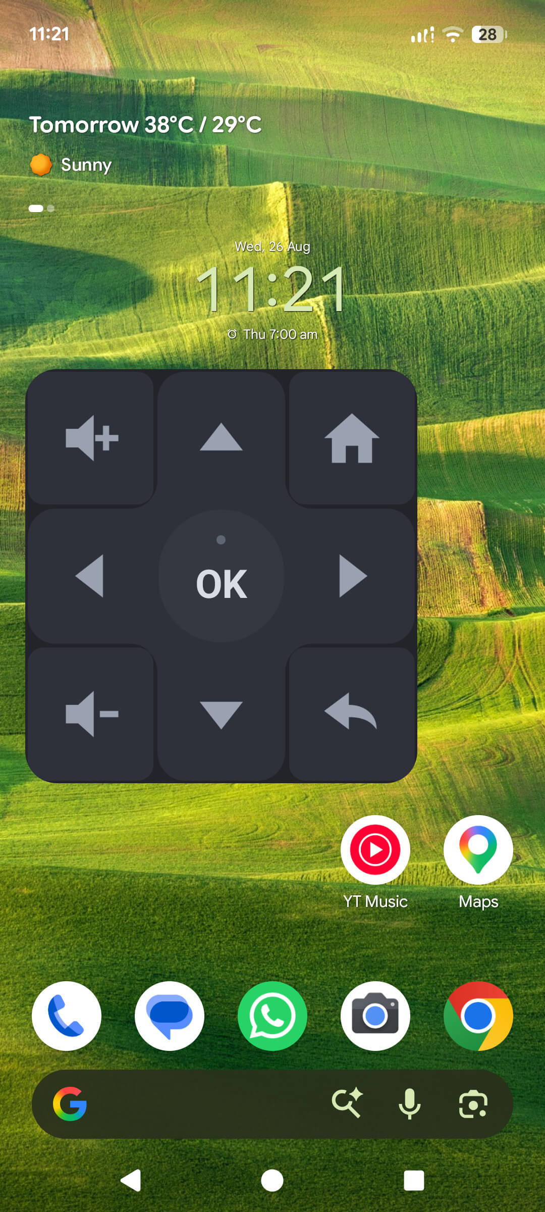 The TV Remote Android home-screen widget: a three-by-three D-pad with volume up, home, back and OK keys sitting on the phone's home screen
